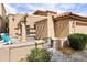 Inviting home exterior featuring a cozy patio with pergola, stylish pavers, and outdoor seating at 7818 E Cactus Wren Rd, Scottsdale, AZ 85250