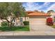 Charming single-story home featuring a tile roof, two-car garage, and well-maintained landscaping at 7818 E Cactus Wren Rd, Scottsdale, AZ 85250