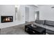 Bright living room with a modern fireplace, plush carpet, and contemporary decor at 7818 E Cactus Wren Rd, Scottsdale, AZ 85250