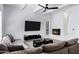 Bright living room featuring a modern fireplace, beamed ceilings and comfortable furnishings at 7818 E Cactus Wren Rd, Scottsdale, AZ 85250