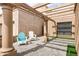 Charming outdoor patio with elegant pergola, stylish brick pavers, and comfortable seating at 7818 E Cactus Wren Rd, Scottsdale, AZ 85250