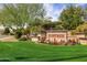 Beautiful community entrance sign surrounded by colorful flowers and manicured landscaping at 7818 E Cactus Wren Rd, Scottsdale, AZ 85250
