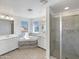 Spacious bathroom with a soaking tub, separate shower, dual vanities, and plenty of natural light at 842 E Beverly Rd, Phoenix, AZ 85042