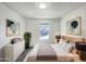 Comfortable bedroom with neutral tones, a large window, and tasteful decor at 842 E Beverly Rd, Phoenix, AZ 85042