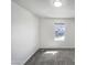 Minimalist bedroom design with carpet floors and a bright window at 842 E Beverly Rd, Phoenix, AZ 85042