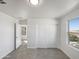 Carpeted bedroom with walk-in closet and bright windows, offering ample natural light and space at 842 E Beverly Rd, Phoenix, AZ 85042