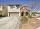 Charming two-story home with stone accents, a two-car garage, and a well-maintained front yard at 842 E Beverly Rd, Phoenix, AZ 85042