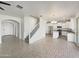 Open concept living area connects to kitchen, features neutral tones, lots of light and tile floors at 842 E Beverly Rd, Phoenix, AZ 85042