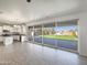 Open-concept living space with tile floors and large sliding glass doors leading to the outdoor area at 842 E Beverly Rd, Phoenix, AZ 85042