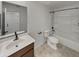 Bathroom featuring a vanity with a framed mirror, toilet, and a shower-tub combination at 8886 S 256Th Dr, Buckeye, AZ 85326