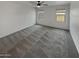Clean, carpeted bedroom with neutral paint and natural light from the window, a peaceful retreat at 8886 S 256Th Dr, Buckeye, AZ 85326
