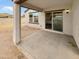 Covered patio offering shade for outdoor living, featuring neutral toned exterior at 8886 S 256Th Dr, Buckeye, AZ 85326