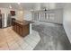 Open-concept kitchen featuring stainless steel appliances and a spacious island at 8886 S 256Th Dr, Buckeye, AZ 85326