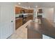 Efficient kitchen with stainless appliances, dark countertops, and ample wood cabinetry, perfect for cooking at 8886 S 256Th Dr, Buckeye, AZ 85326
