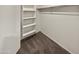 Walk-in closet with custom shelving to help keep everything organized at 8886 S 256Th Dr, Buckeye, AZ 85326