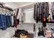 Well-organized walk-in closet with shelves, hanging rods, and plenty of storage space at 9700 E Harvest Rd, Florence, AZ 85132