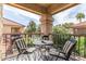 Inviting balcony featuring a table and chairs with a view of lush landscaping and a pool at 9711 E Mountain View Rd # 2524, Scottsdale, AZ 85258