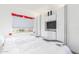 Bright bedroom featuring a bed with white bedding and built-in storage with a TV and drawers at 9711 E Mountain View Rd # 2524, Scottsdale, AZ 85258