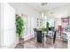 Bright dining room with glass table, modern light fixture and large mirrored wall at 9711 E Mountain View Rd # 2524, Scottsdale, AZ 85258