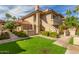 Charming condo with well-maintained landscaping, colorful plants, and a green lawn at 9711 E Mountain View Rd # 2524, Scottsdale, AZ 85258