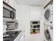 Bright kitchen featuring stainless steel appliances, white cabinets and backsplash at 9711 E Mountain View Rd # 2524, Scottsdale, AZ 85258