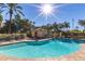 Sparkling community pool with ample lounge seating and a bright sunny sky at 9711 E Mountain View Rd # 2524, Scottsdale, AZ 85258