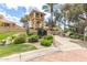Beautifully landscaped entrance to the community's racquet club with lush greenery at 9711 E Mountain View Rd # 2524, Scottsdale, AZ 85258