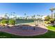 Well-maintained tennis courts with a decorative water feature in the foreground at 9711 E Mountain View Rd # 2524, Scottsdale, AZ 85258