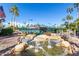 Scenic view of well-maintained tennis courts with a decorative water feature in the foreground at 9711 E Mountain View Rd # 2524, Scottsdale, AZ 85258