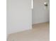 Bright room with tile flooring, white walls, baseboards, and a contemporary recessed window at 10302 E Utah Ave, Mesa, AZ 85212