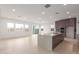 A kitchen island with sink and dishwasher separates the kitchen from the living room at 10302 E Utah Ave, Mesa, AZ 85212