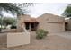 Charming desert home with a red tile roof and a xeriscaped yard and covered entry at 10812 N 117Th Pl, Scottsdale, AZ 85259