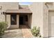 Inviting front entry with a red brick walkway and xeriscaped desert plantings at 10812 N 117Th Pl, Scottsdale, AZ 85259