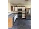 Well-lit kitchen featuring stainless steel appliances, two-tone cabinets, and a tiled floor at 11521 W Charter Oak Rd, El Mirage, AZ 85335