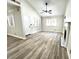 Inviting living room featuring wood floors, a vaulted ceiling, fireplace and light-filled windows with blinds at 1222 W Baseline Rd # 159, Tempe, AZ 85283