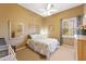 Charming bedroom with natural light, complemented by a decorative mirror and dresser at 12706 E Desert Cove Ave, Scottsdale, AZ 85259