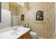 Stylish powder room with unique wallpaper and a decorative mirror above the sink at 12706 E Desert Cove Ave, Scottsdale, AZ 85259