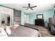 Cozy bedroom with barn door, a dresser, and walk-in closet at 13153 W Clarendon Ave, Litchfield Park, AZ 85340