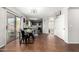 Inviting dining area with sliding glass doors, an open floorplan, and stylish decor at 13153 W Clarendon Ave, Litchfield Park, AZ 85340