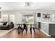 Open dining area featuring modern table set and connection to living area at 13153 W Clarendon Ave, Litchfield Park, AZ 85340