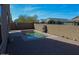 Private backyard pool with brick patio and block wall surround at 13612 W Desert Moon Way, Peoria, AZ 85383