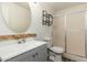 Updated bathroom featuring a modern vanity, decorative mirror, shower, and tile floor at 13807 N 33Rd Dr, Phoenix, AZ 85053