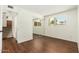 Bedroom featuring hard floors, a sliding mirror closet and a window overlooking the yard at 13807 N 33Rd Dr, Phoenix, AZ 85053