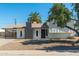 Charming single-Gathering home featuring a gray painted chimney and a covered front porch at 13807 N 33Rd Dr, Phoenix, AZ 85053