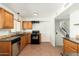 Well-lit kitchen with stainless steel dishwasher, tile backsplash, and tile floors at 13807 N 33Rd Dr, Phoenix, AZ 85053