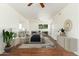 Bright and airy main bedroom featuring a ceiling fan, wood floors, and neutral walls at 13807 N 33Rd Dr, Phoenix, AZ 85053