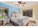 Spacious main bedroom featuring ample natural light, neutral tones, and a comfortable bed with stylish decor at 14300 W Bell Rd # 117, Surprise, AZ 85374