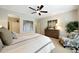 Relaxing main bedroom features a ceiling fan and neutral decor at 15501 W Las Verdes Way, Surprise, AZ 85374