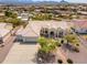 Stunning aerial view of a home with a tile roof, lush landscaping, and a circular driveway at 15803 E Tumbleweed Dr, Fountain Hills, AZ 85268