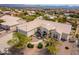 Expansive aerial view showcasing the home's tiled roof, desert landscaping, and the surrounding community at 15803 E Tumbleweed Dr, Fountain Hills, AZ 85268